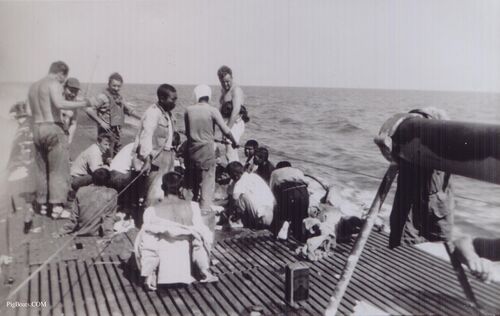 Japanese merchant sailors rescued from rafts - Beaumont standing in photo center
